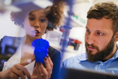 A female professor helping a male student