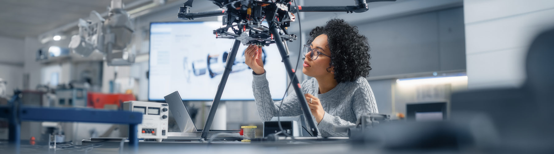 A female engineer working on a drone