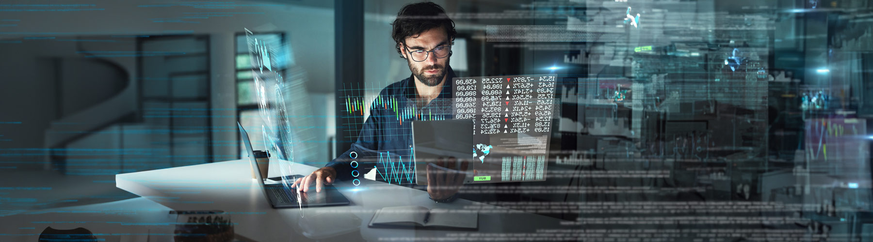 A man trading stocks at a computer terminal